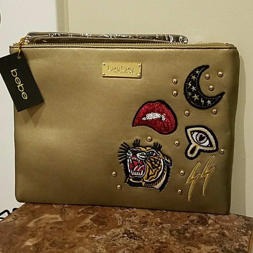 Sold.         Bebe clutch